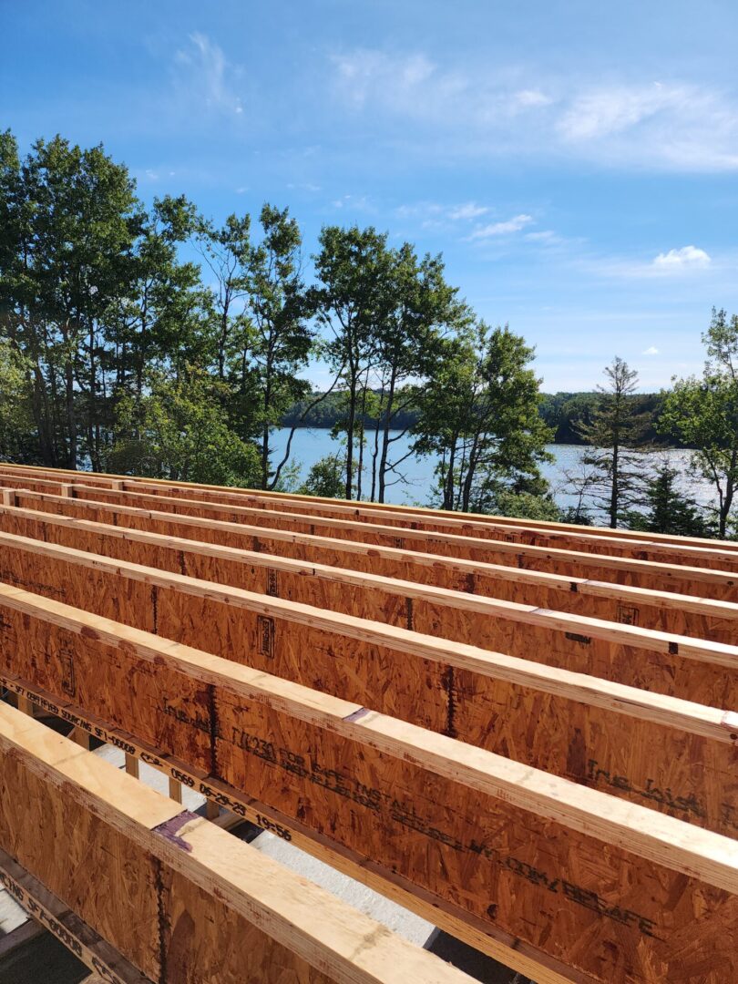 A view of some wooden beams sitting on top of a building.