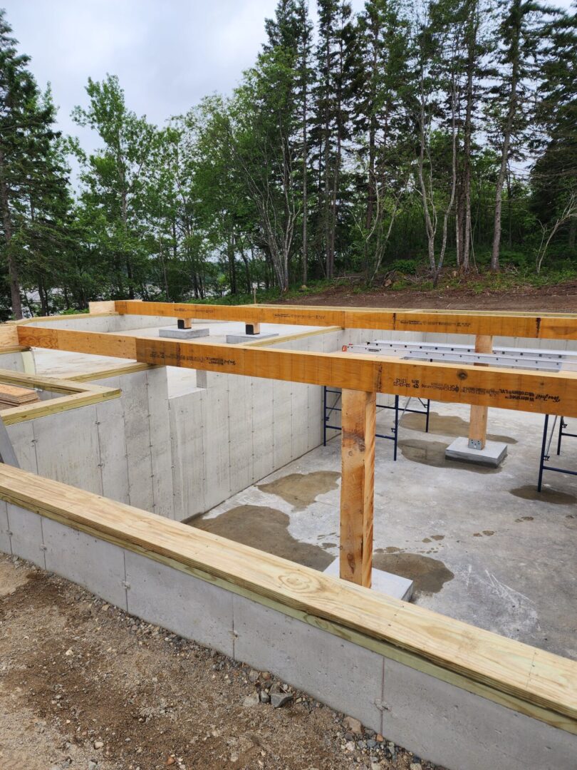 A building under construction with wood and concrete.