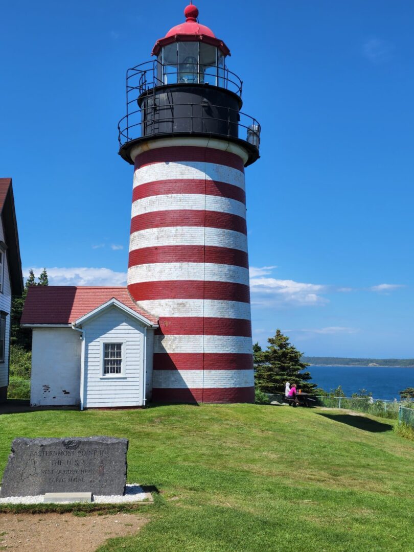 A lighthouse with red and white stripes on it