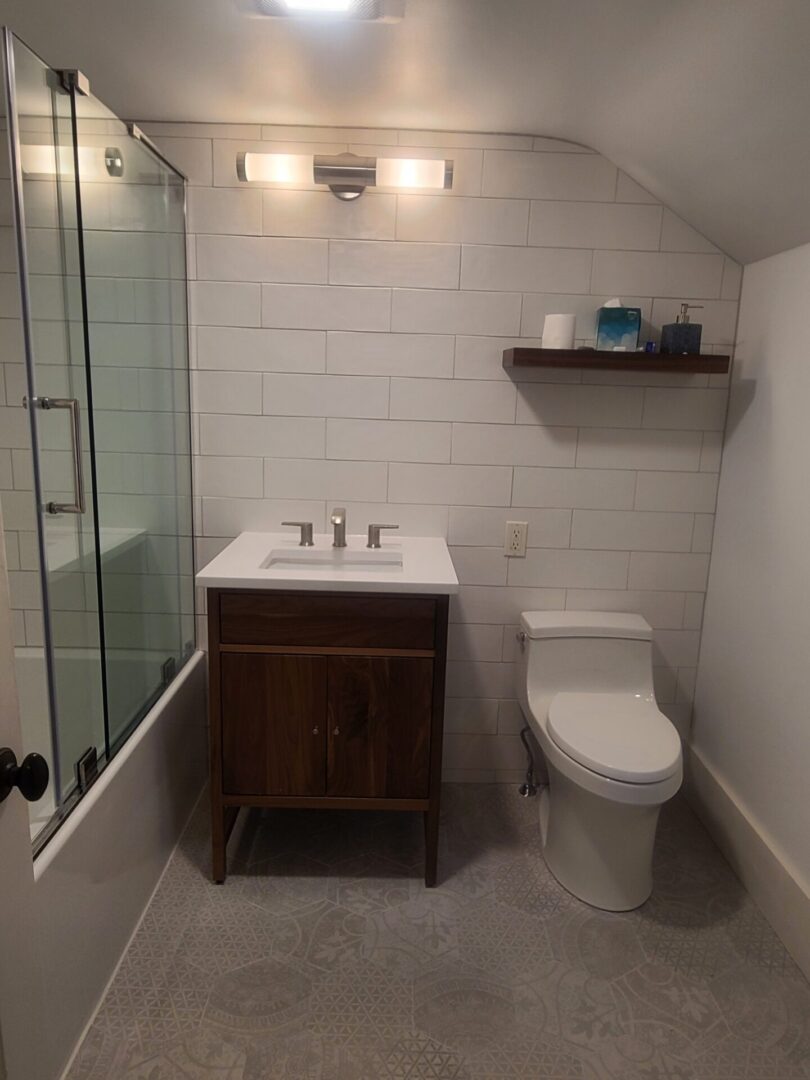 A bathroom with a toilet and sink in it