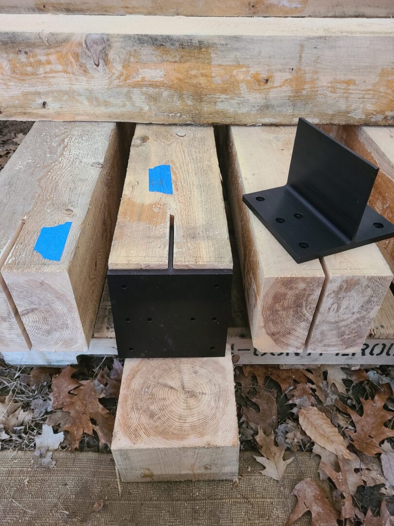 A couple of wooden blocks with blue tape on them.