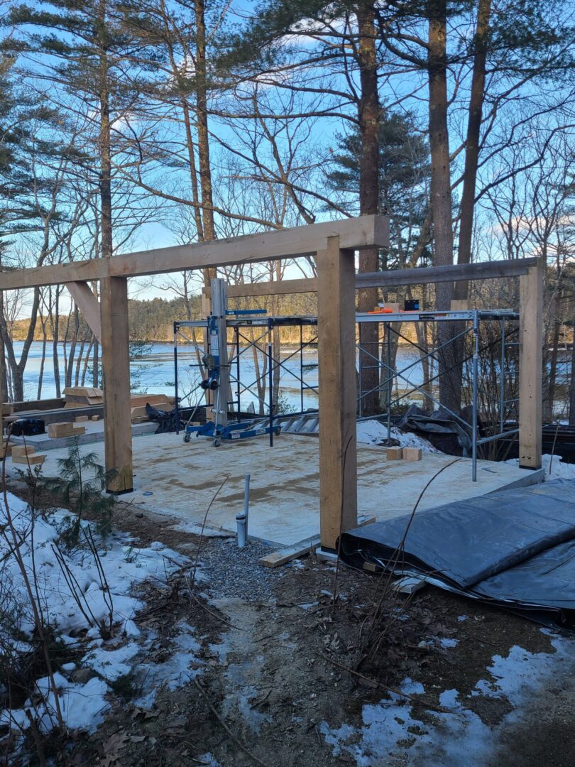 A wooden structure in the middle of a forest.