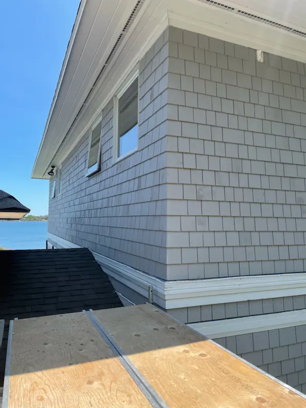 A house with a roof that has been cut off.