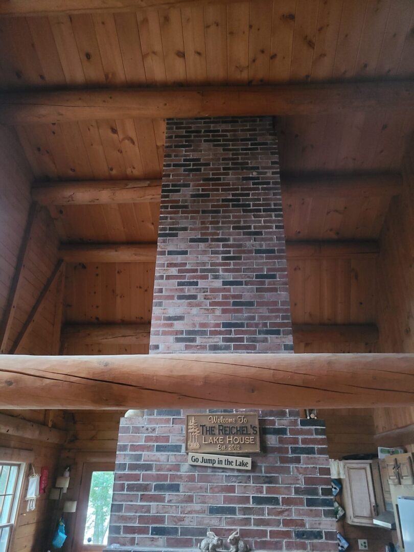 A brick fireplace in the middle of a room.