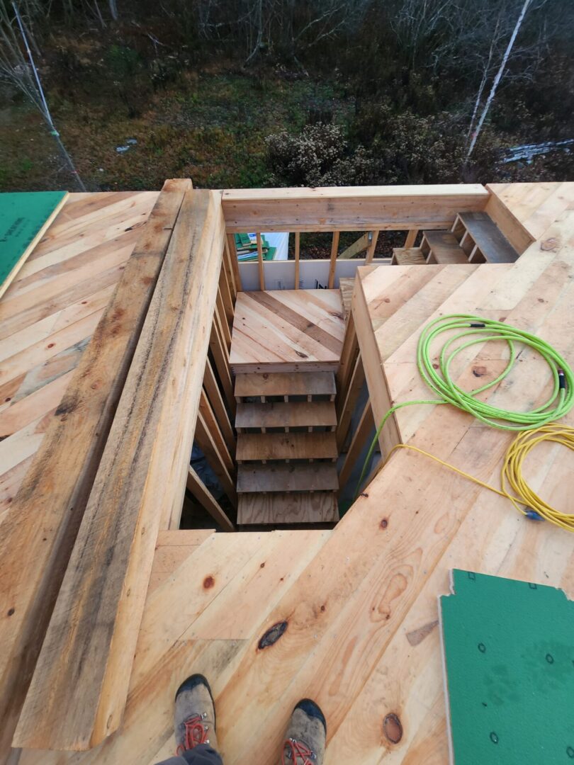 A wooden structure with stairs going up to it.