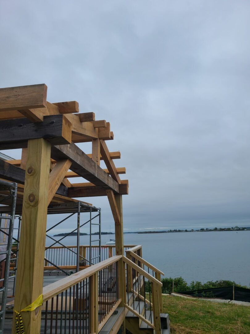 A wooden structure with a view of the water.