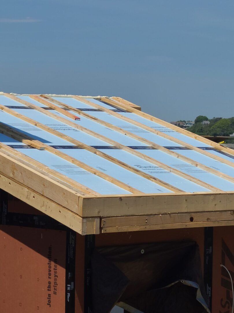 A roof with blue insulation on it